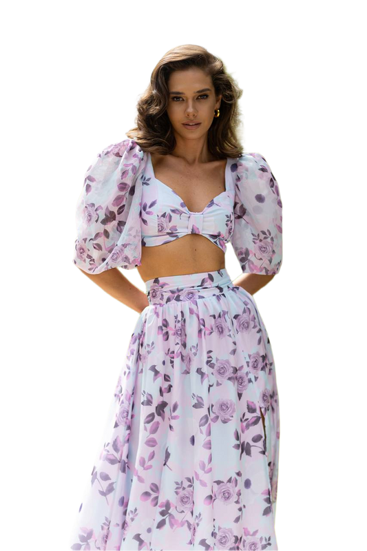 Woman wearing a floral two-piece outfit on a white background