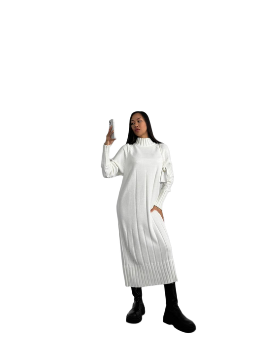 Person wearing a white dress with long sleeves on a white background