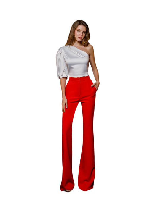 Woman wearing a white top and red pants on a white background