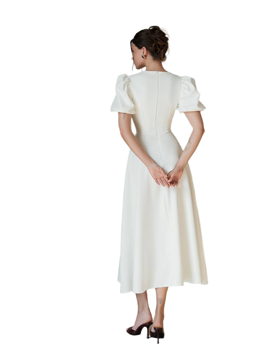 Woman wearing a white dress with short sleeves on a white background