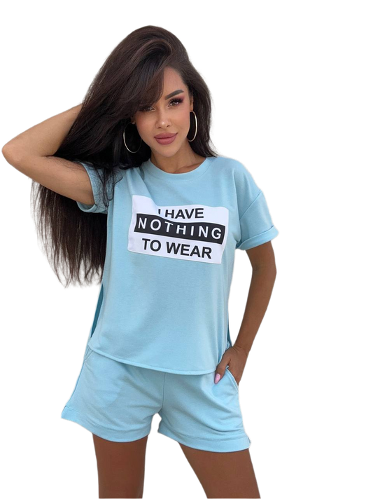 Woman wearing a light blue t-shirt with text and matching shorts on a white background