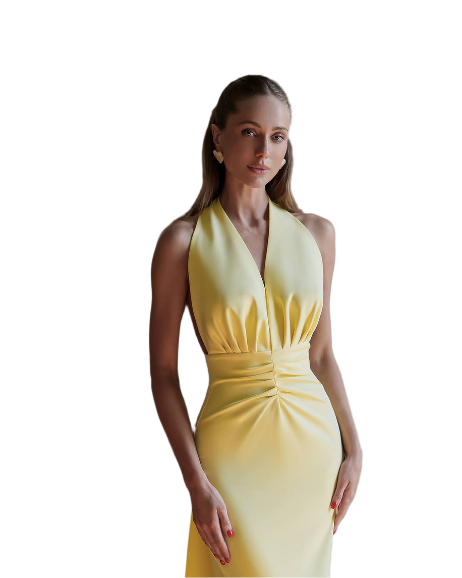 Woman wearing a yellow halter neck dress on a white background