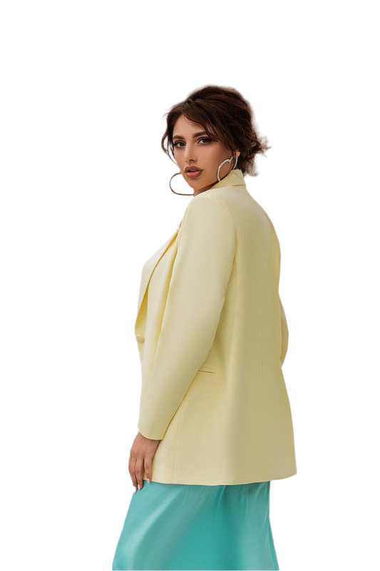 Woman wearing a light yellow blazer and turquoise pants on a white background