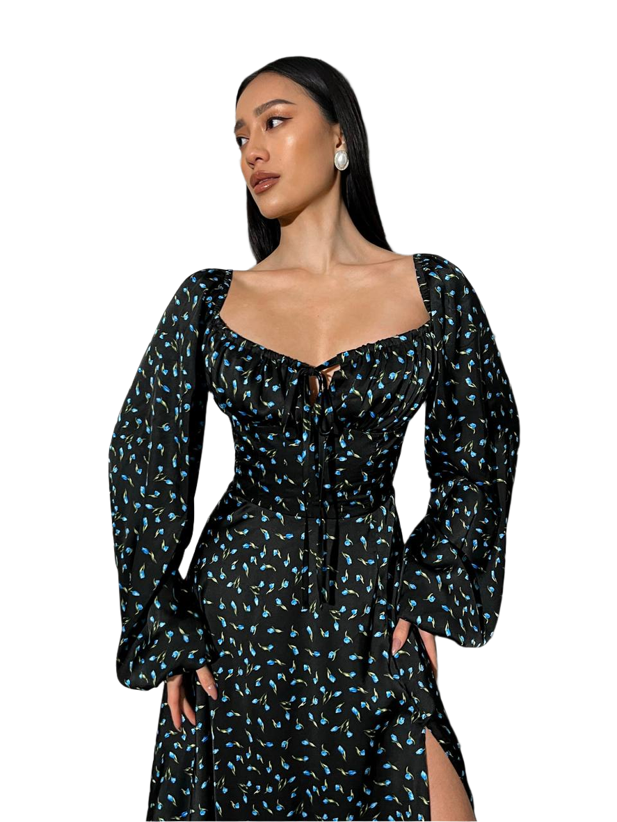 Woman wearing a black floral dress on a white background