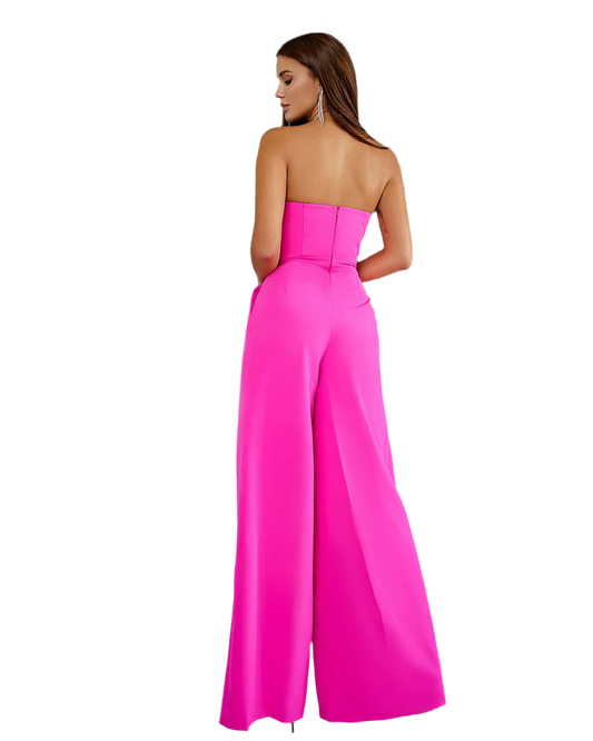 Woman wearing a strapless pink jumpsuit on a white background