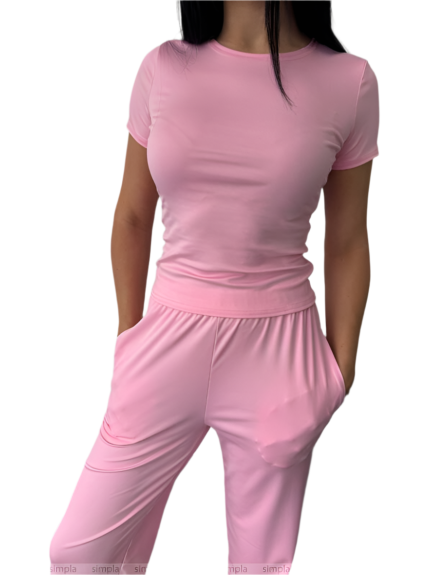 Person wearing a pink outfit on a white background