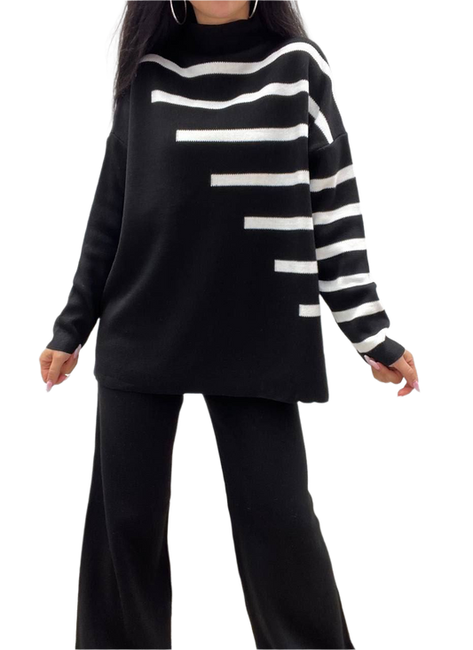 Black and white striped sweater worn by a person on a white background