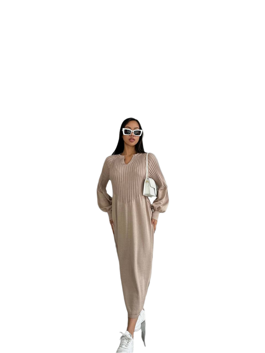Woman wearing a beige ribbed dress with sunglasses and white sneakers on a white background