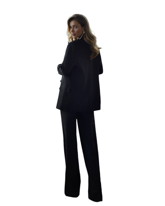 Person wearing a black suit on a white background