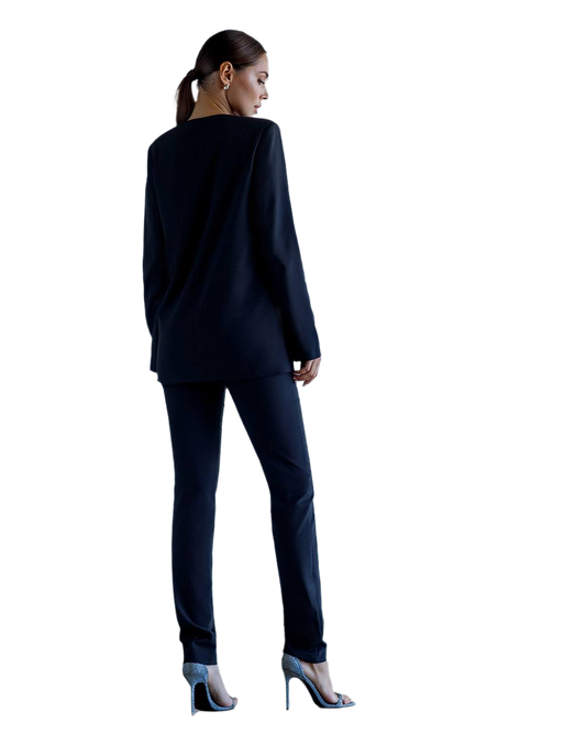 Woman wearing a navy suit on a white background