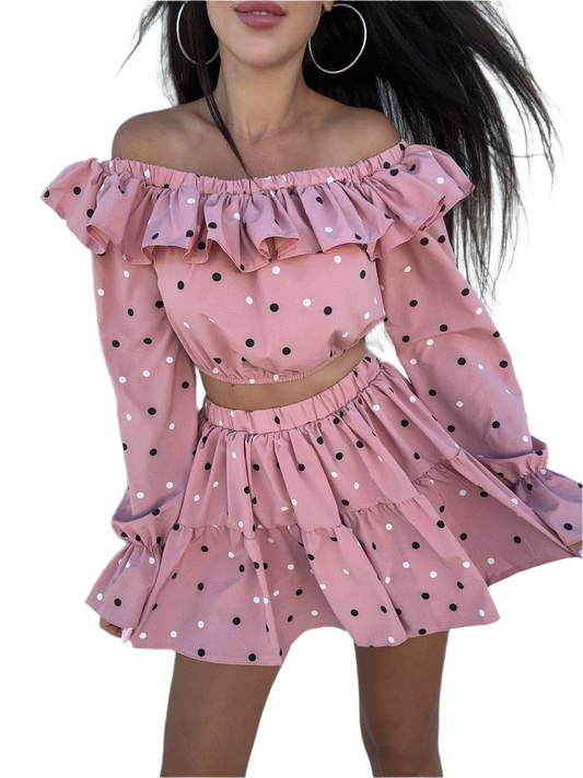 Pink polka dot off-shoulder top and skirt set on a white background