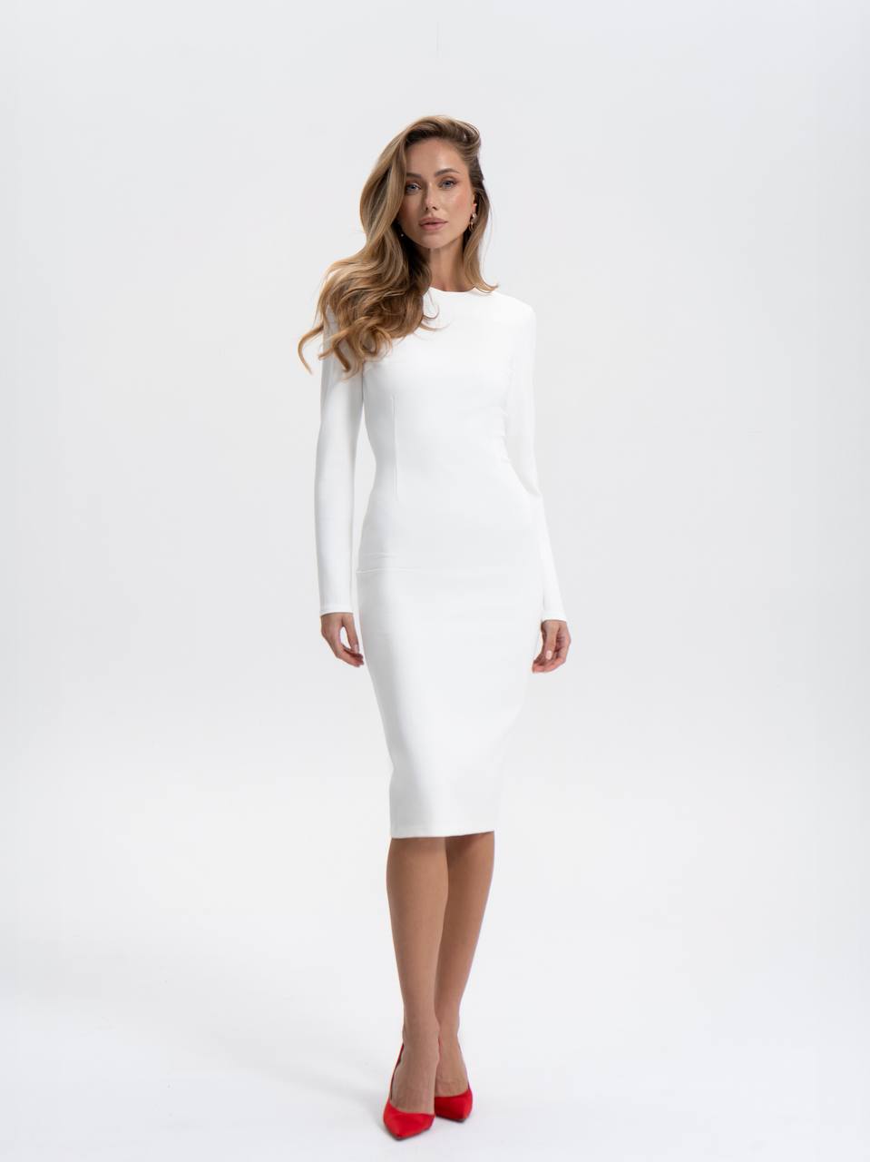 Woman wearing a white dress on a white background