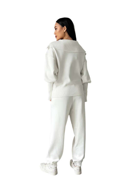 Person wearing a white outfit on a white background