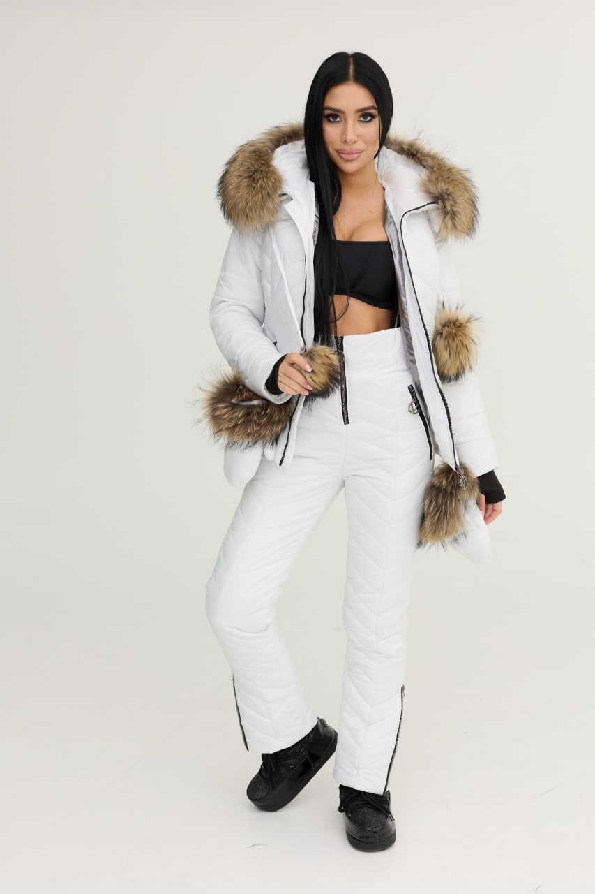 Woman wearing a white puffer jacket with fur trim on a white background