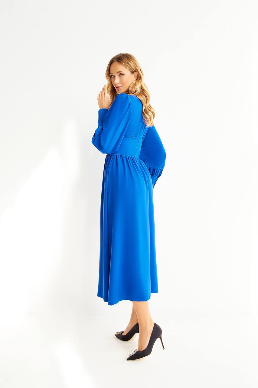 Woman wearing a blue dress on a white background