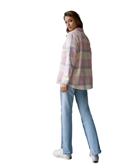 Woman wearing a plaid shirt and jeans on a white background
