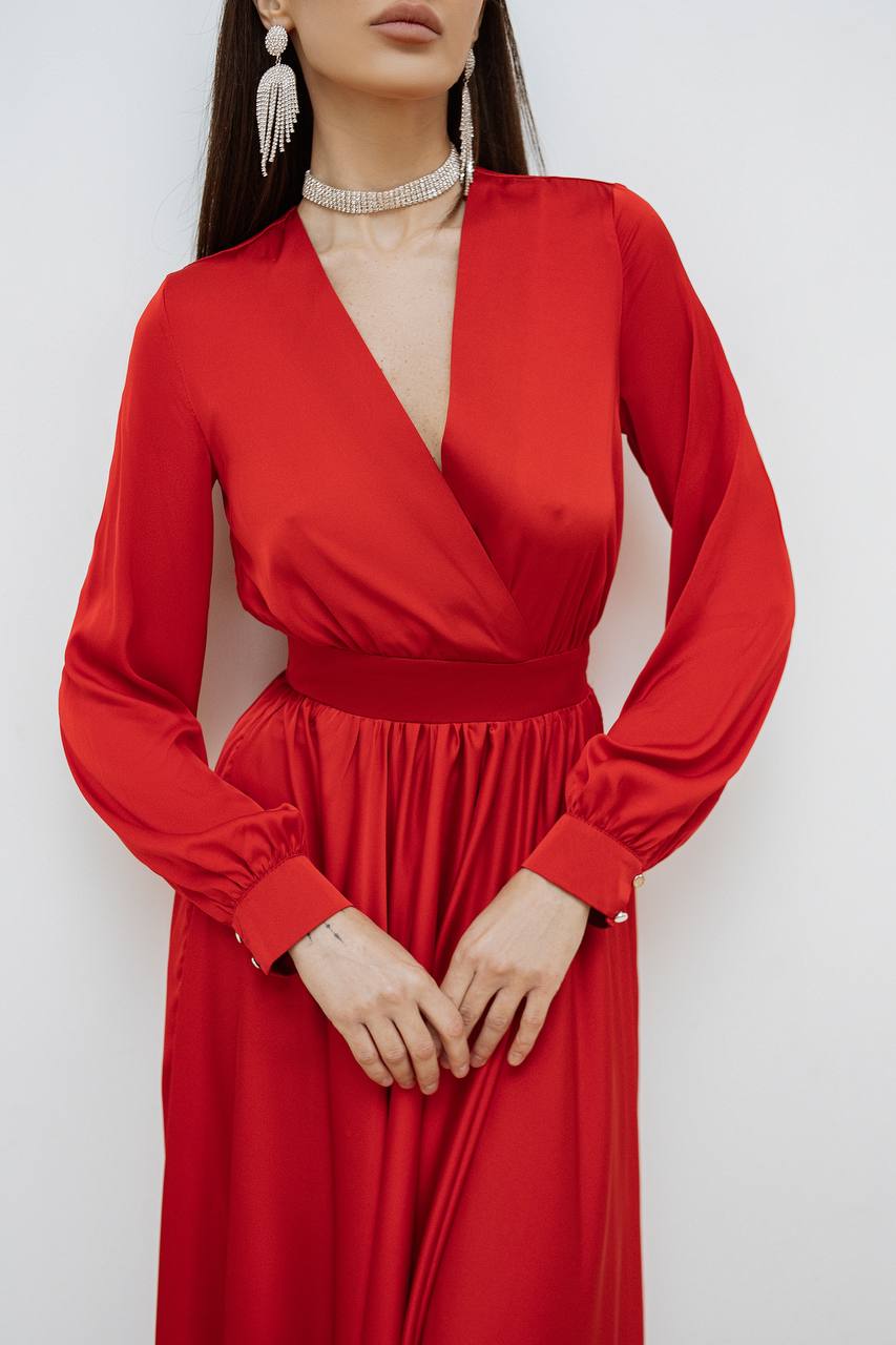 Red dress worn by a model against a white background