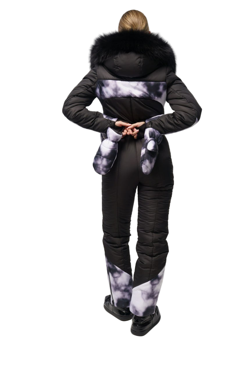 Person wearing a black puffer suit with fur-lined hood on a white background