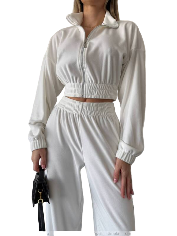 White tracksuit worn by a person on a white background
