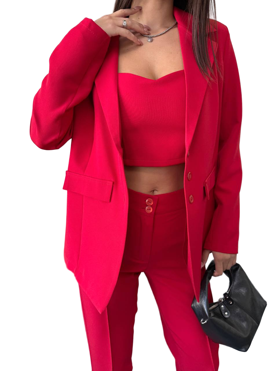 Person wearing a red outfit with a matching blazer on a white background