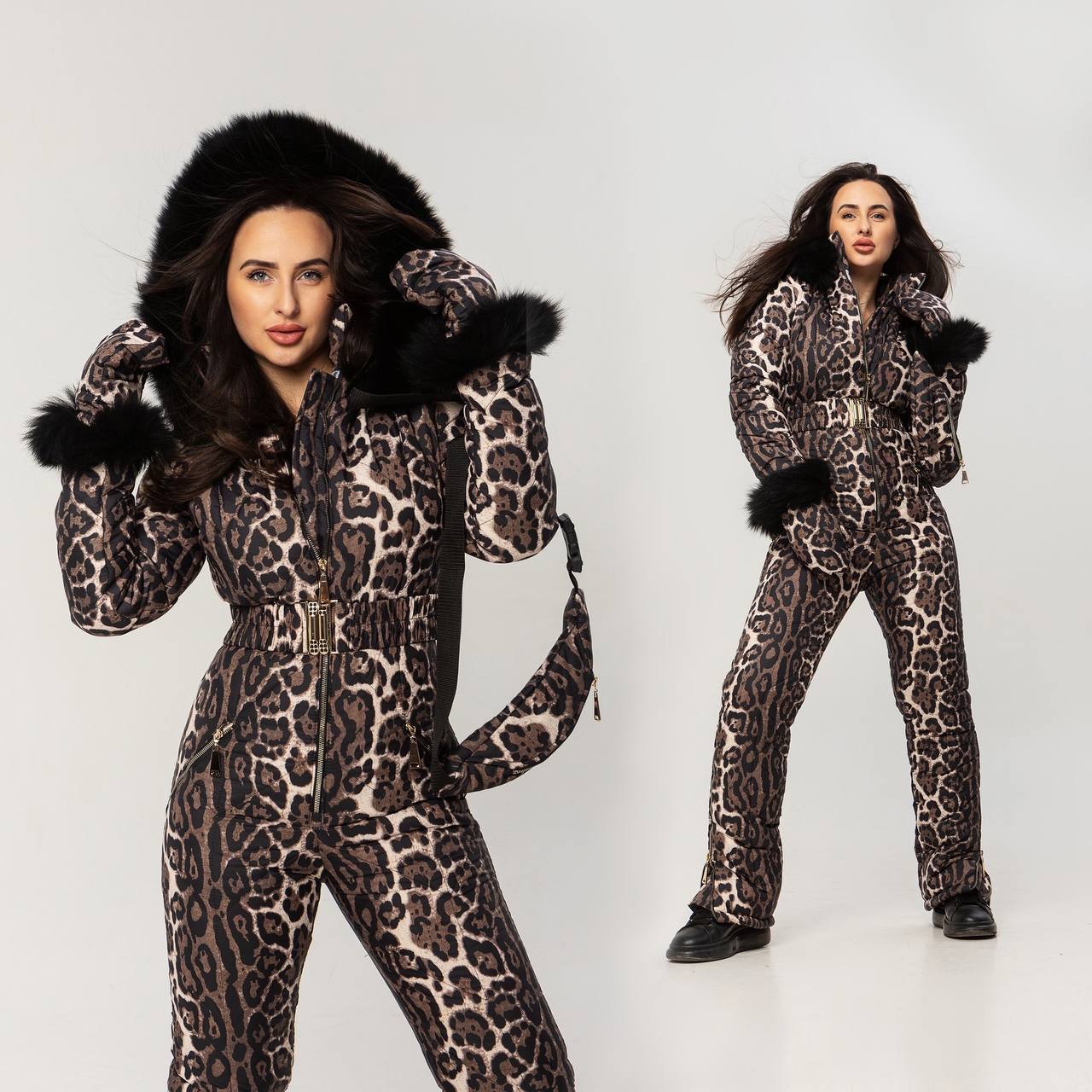 Woman wearing a leopard print snowsuit with fur trim on a white background