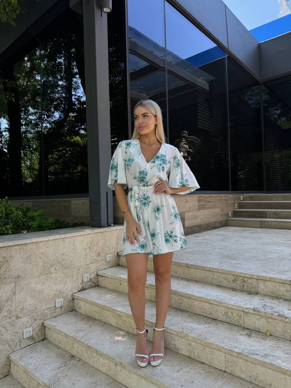 White Floral Staple Fabric Jumpsuit with V Neck and Short Flowy Sleeves