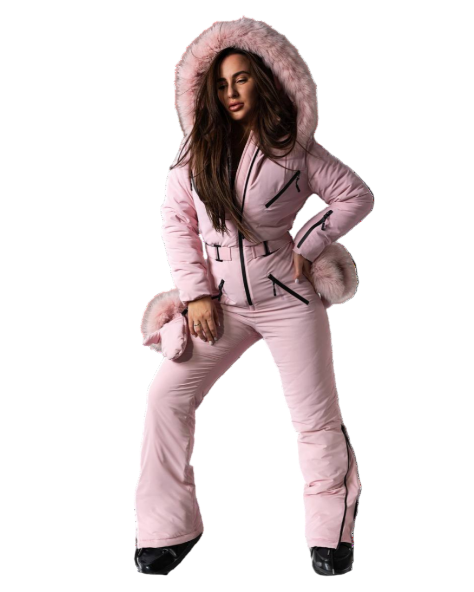 Person wearing a pink snowsuit with fur trim on a white background
