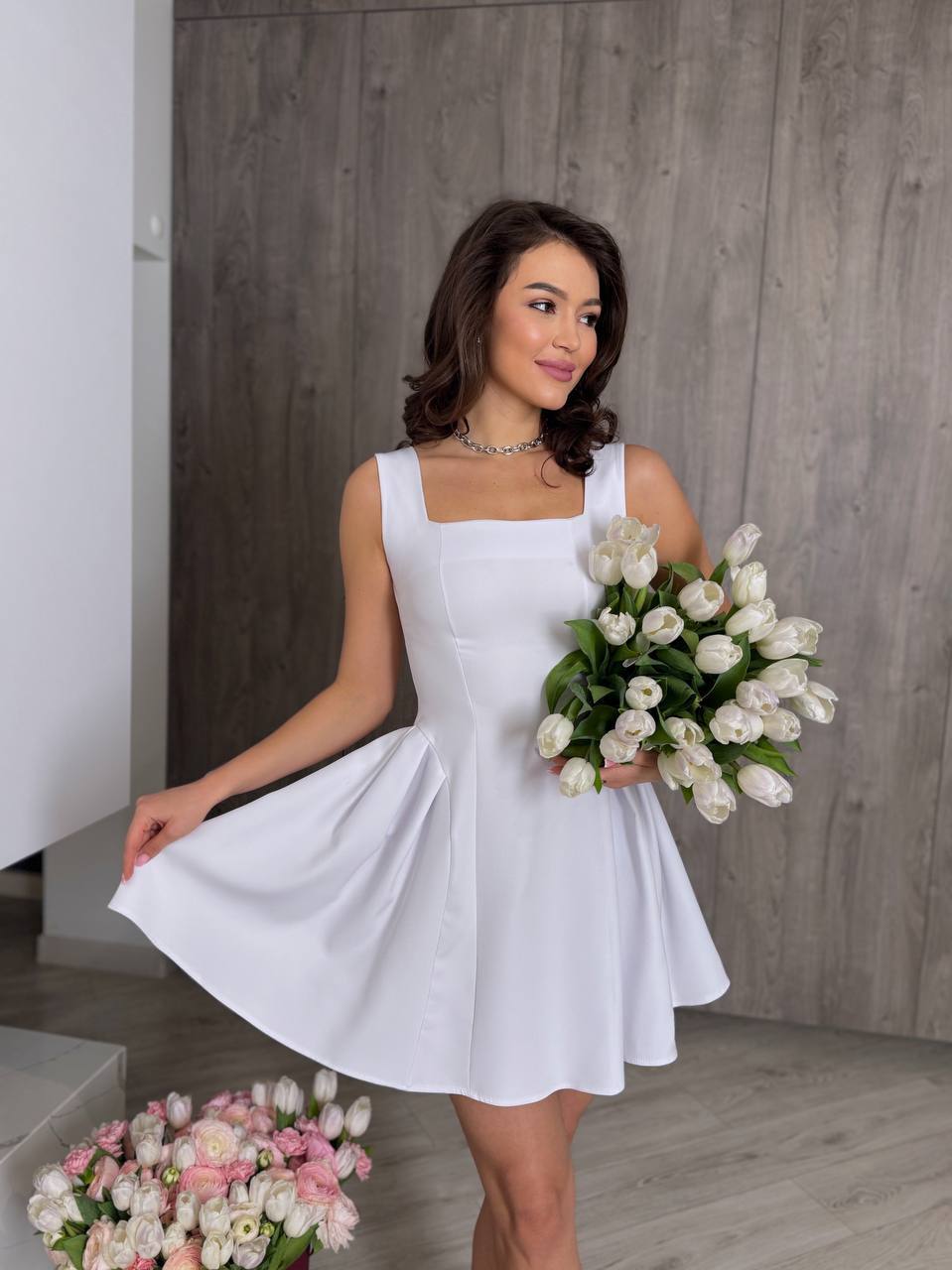 Elegant White Sleeveless Dress with Flared Skirt