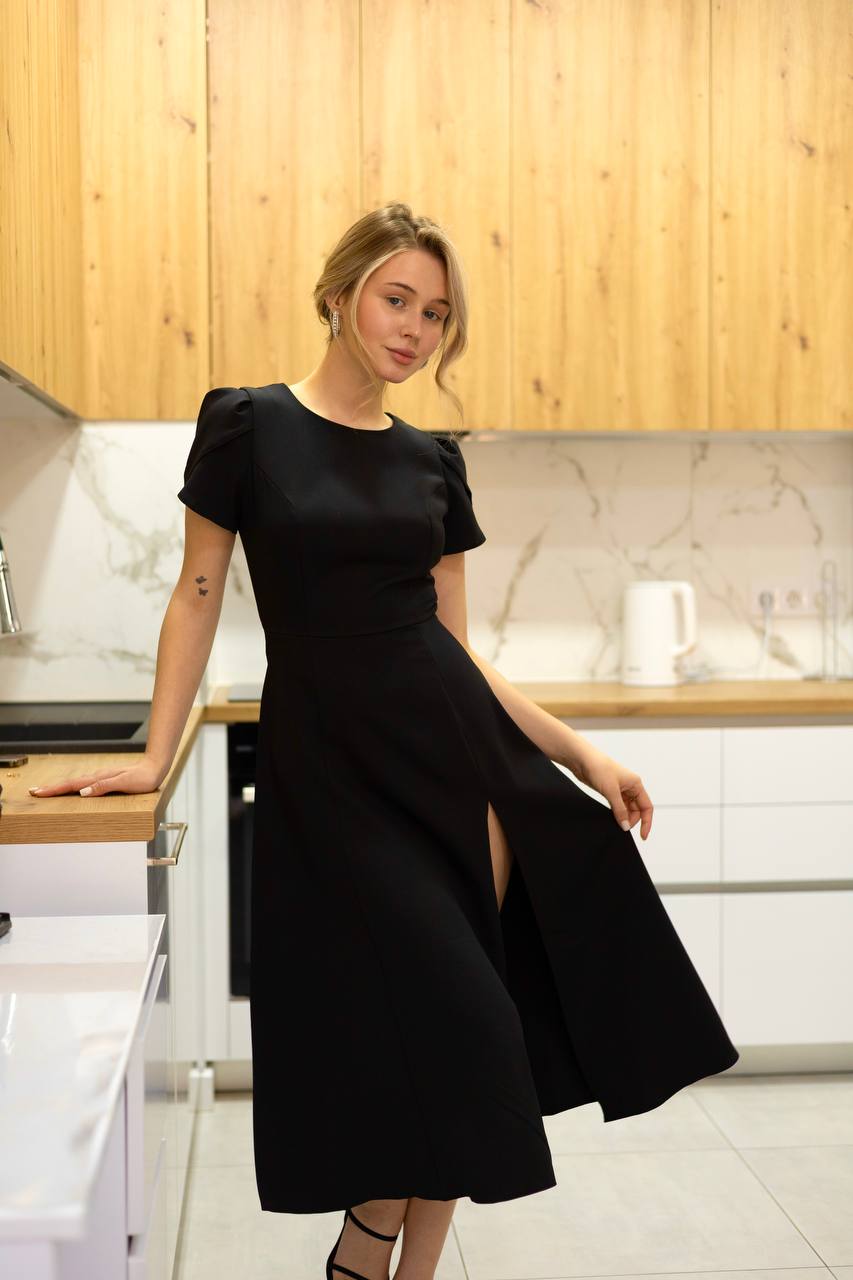 Elegant Black Dress with Open Back and Side Slit for Stylish Occasions