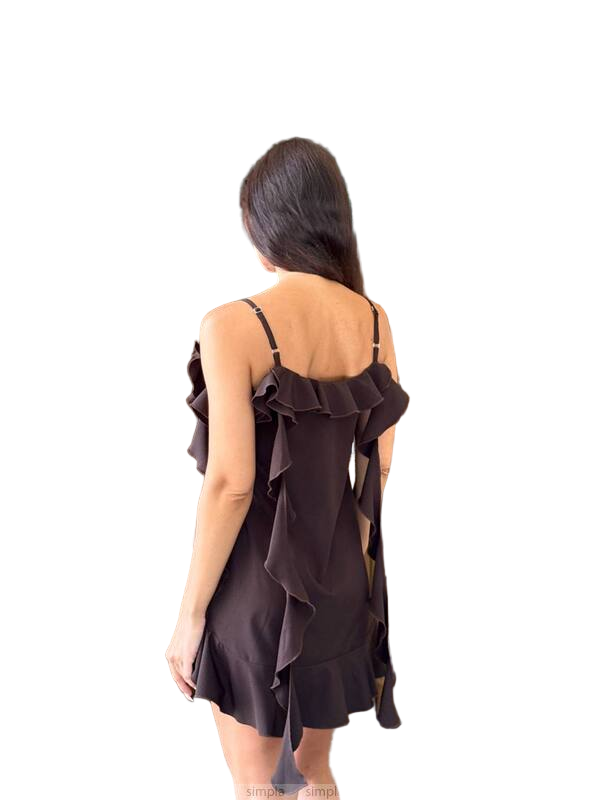 Woman wearing a brown dress with ruffled details on a white background
