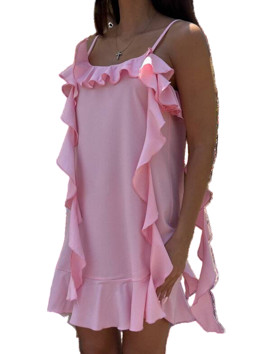 Pink ruffled dress worn by a person on a white background
