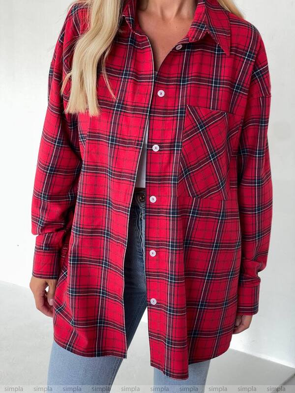 Red plaid shirt worn by a person on a white background