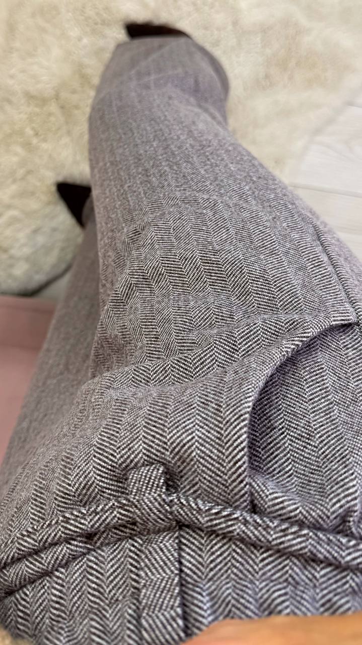 Close-up of a patterned fabric on a textured surface
