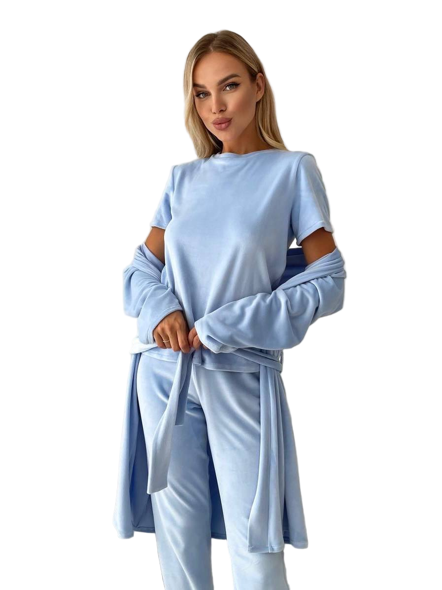 Woman wearing a light blue outfit with a matching jacket on a white background