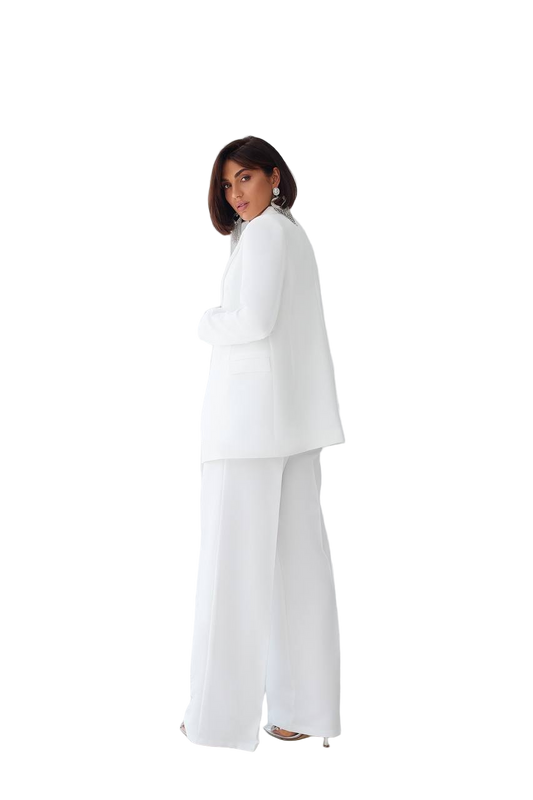 Woman wearing a white suit on a white background