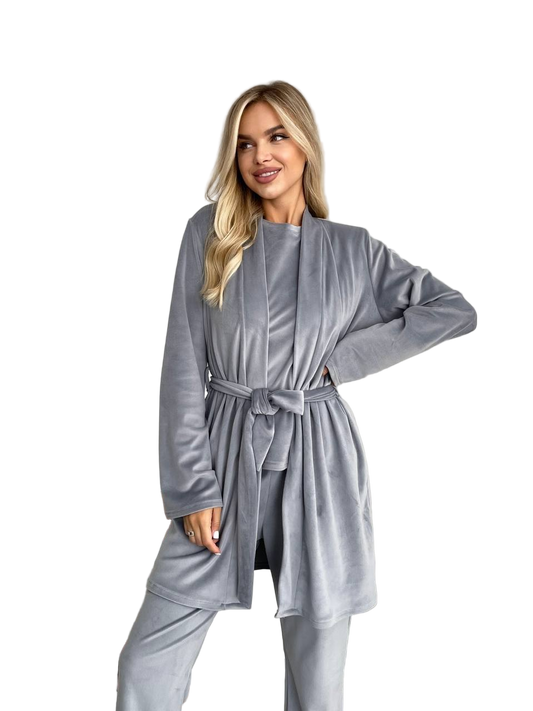 Woman wearing a gray robe with a belt on a white background