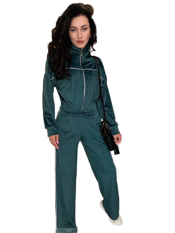 Woman wearing a green tracksuit with a white background