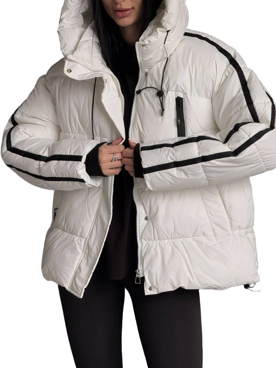 White puffer jacket with black accents worn by a person on a white background