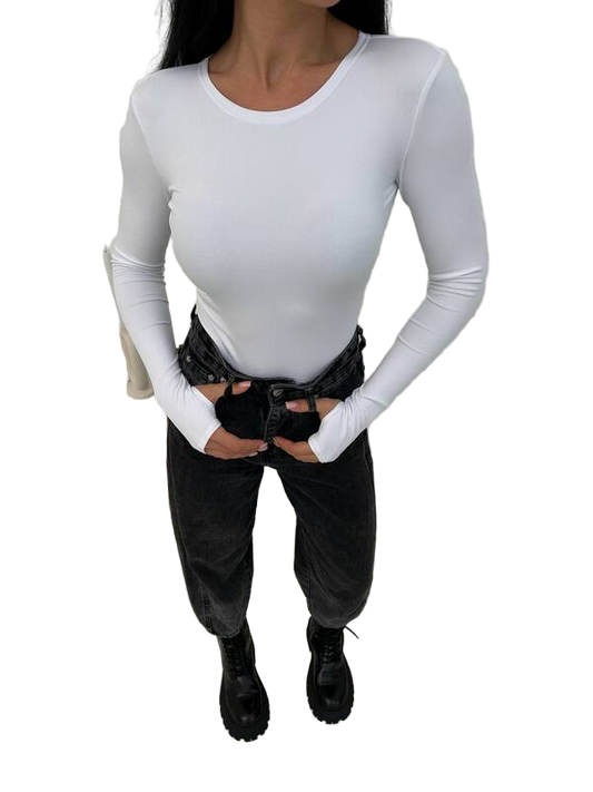 Person wearing a white long-sleeve top and black pants on a white background