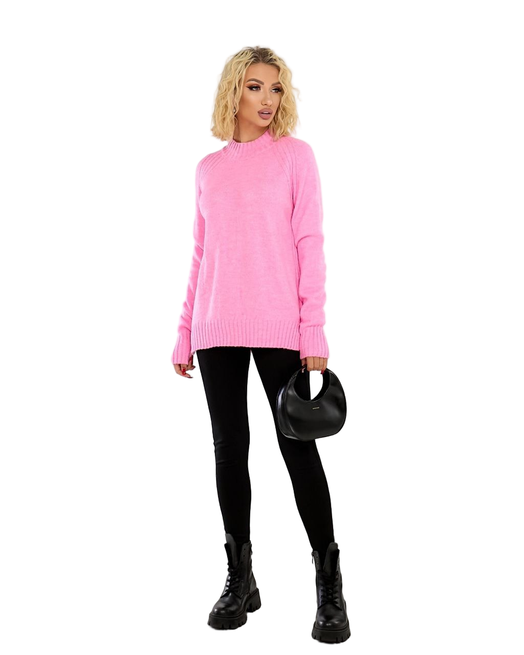 Woman wearing a pink sweater and black pants on a white background