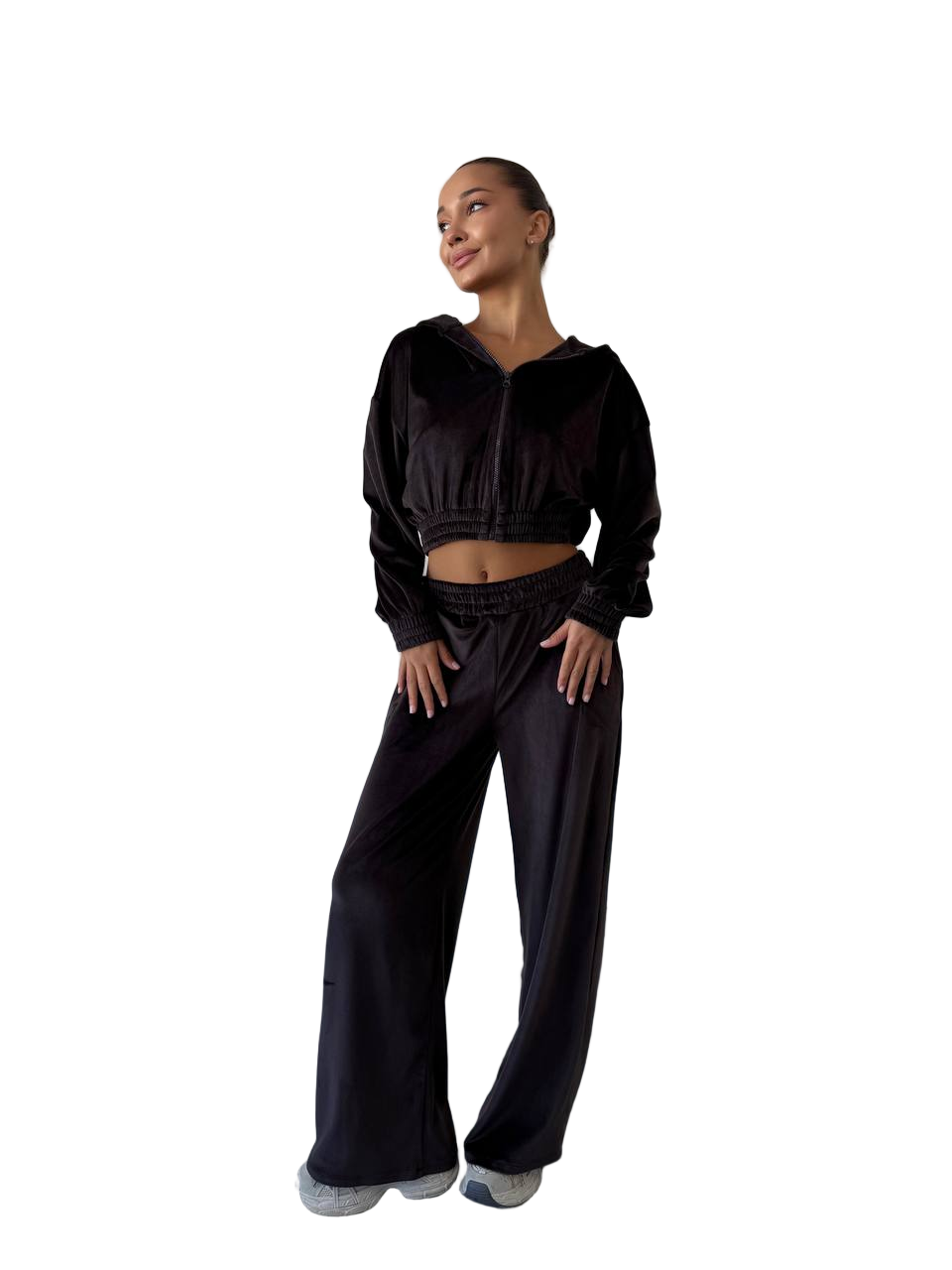 Woman wearing a black outfit on a white background