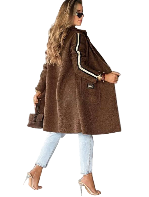 Woman wearing a brown coat with white stripes on a white background