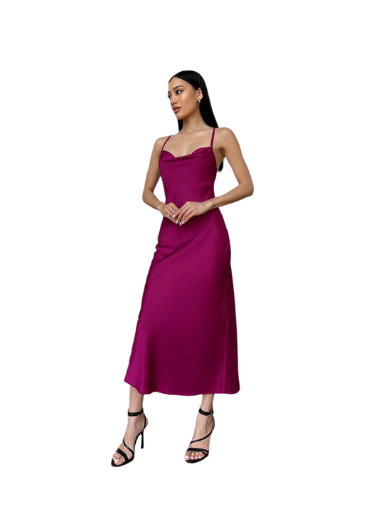 Woman wearing a magenta dress on a white background