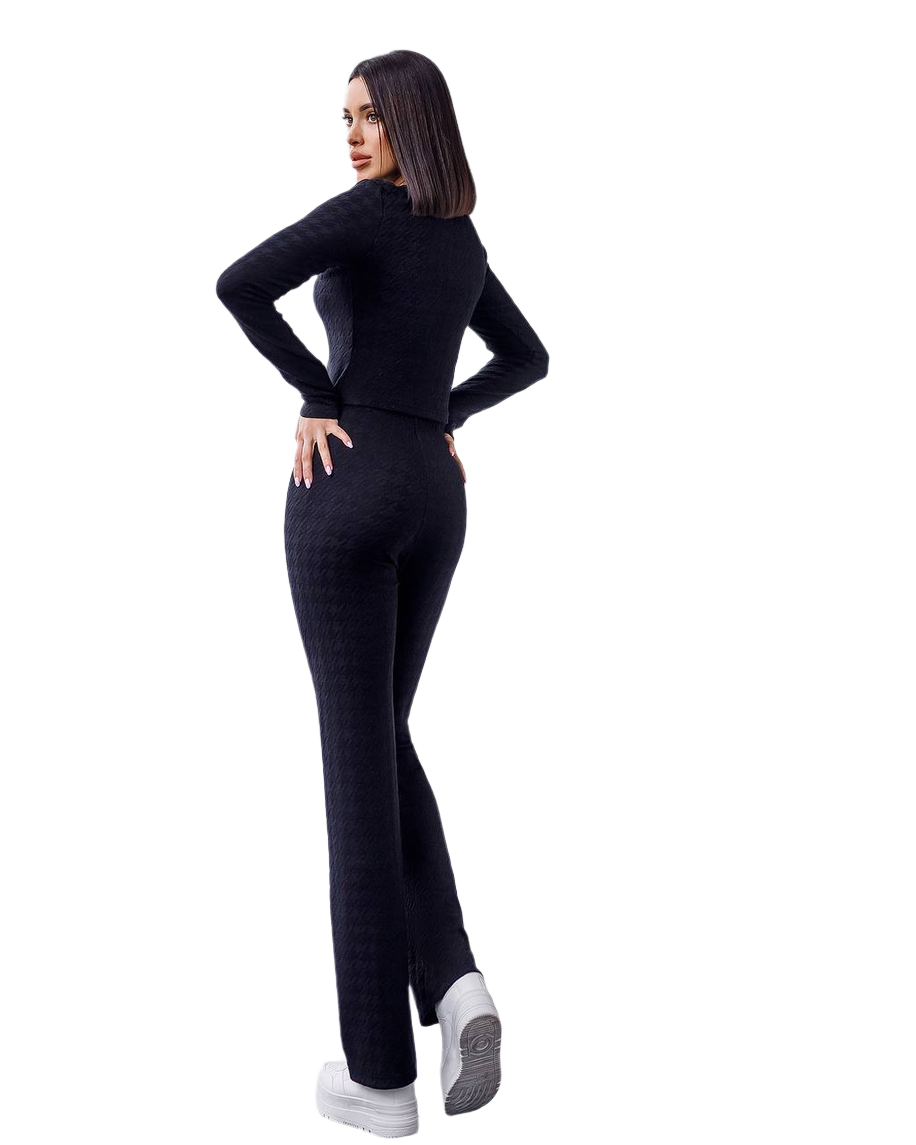 Woman wearing a black outfit on a white background