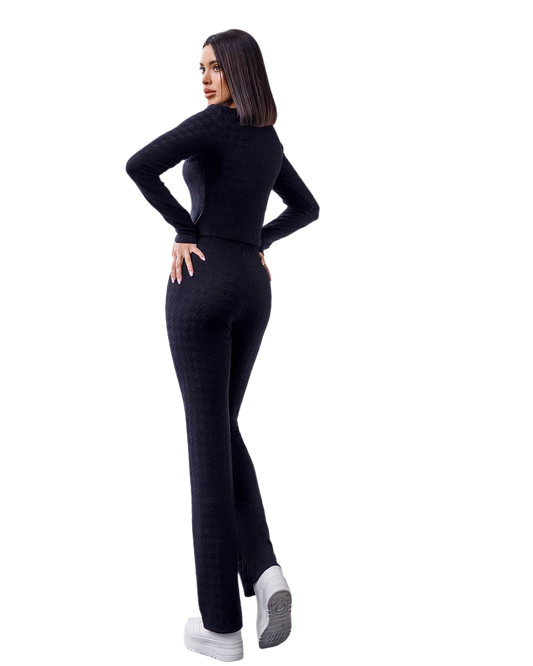 Woman wearing a black outfit on a white background