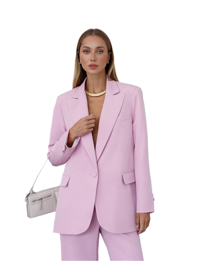 Woman wearing a pink suit with a white background