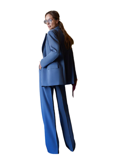 Woman wearing a blue suit on a white background