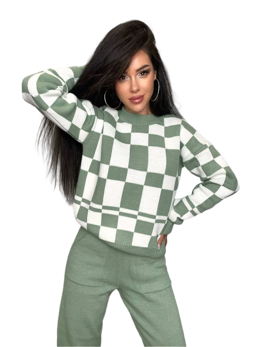 Woman wearing a green and white checkered sweater on a white background