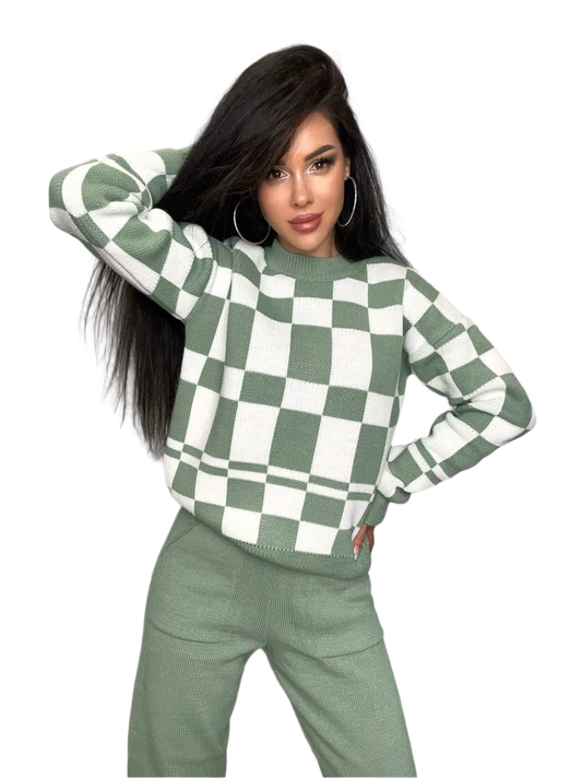 Woman wearing a green and white checkered sweater on a white background