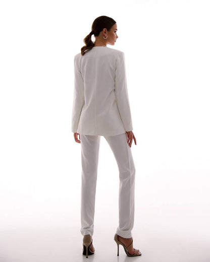 Woman wearing a light gray suit on a white background